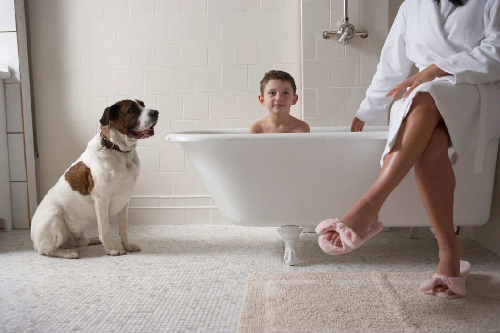 A dog and two children in the bathroom